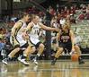 Kayla Hudson dribbles around 2 Vanderbilt players in the exhibition game in Nashville.  - Photo by Morris Abernathy