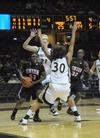 Lavanda Ross works the ball in for a shot while Mildred Olumasi gets positioned for a possible rebound.  - Photo by Morris Abernathy