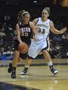 Kayla Hudson dribbles the ball around Vanderbilt's Rebecca Silinski during an exhibition game held at Vandy.  - Photo by Morris Abernathy