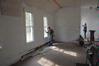 Students and faculty from the history department work on restoring a church in Casey Jones Village as part of Campus and Community Day.  - Photo by Morris Abernathy