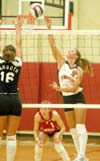 Freshman outside hitter Kelly Huffines goes for the kill in Union's 3-0 win over Lambuth.  Union's libero, Allison Shein (1) watches from the back line. - Photo by Steven Aldridge