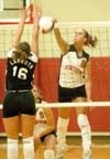 Jennie Glassey (8) gets one of her kills in Union's 3-0 win over Lambuth.  Kelly Huffines (9) for Union looks on. - Photo by Steven Aldridge