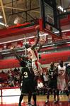 Samuel Danache goes up for a shot under the goal while Life University defensive players guard him.
 - Photo by Ebbie Davis