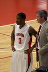 C.J. Davis and David Niven, head men's basketball coach, discuss a play on the sidelines during a game against Life University.  - Photo by Ebbie Davis