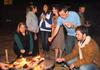 Heritage Complex residents gather around a fire pit to toast their marshmallows during S'more Giving. S'more Giving is a competition between residence complex buildings to raise the most change to provide Thanksgiving meals to needy families in the Jackson community. - Photo by Victoria Stargel