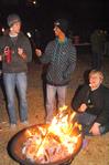 David Knack, Tommy Woods, and Adam Stanford roast marshmallows at the S'more Giving event hosted by Residence Life.  - Photo by Victoria Stargel