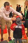 Chase Tuggle, sophomore youth ministry major, and Mazie Walthall, junior nursing major, help give Christmas gifts to a special child during the Carl Perkins Christmas Party sponsored by SAC.  - Photo by Victoria Stargel