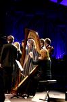 Anna Wicker, senior music major, plays the harp with the choral group, Proclamation, at A Union Christmas. - Photo by Deanna Santangelo