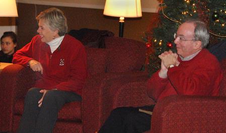 Dr. and Mrs. Dockery, president and first lady of Union, listen as students share favorite Christmas memories during the annual Christmas Story with the Dockerys.  