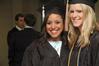 Business administration graduates Kimberly Middleton Sarah Bedwell pose together before receiving their diplomas at West Jackson Baptist Church. - Photo by Beth Spain