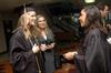 Sarah Bedwel, Amanda Tuzzio, and Kimberly Middleton stand together prior to lining up for graduation at West Jackson Baptist Church. - Photo by Beth Spain