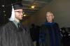 Cory Poston, Christian studies graduate, and James Patterson, associate dean of the School of Theology & Missions, talk with other students from their department before the 2010 Fall Commencement Services.  - Photo by Beth Spain