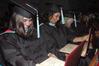 Graduates eagerly open their diplomas after receiving them at the 2010 Fall Commencement Services.  - Photo by Beth Spain