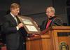 David S. Dockery (right), university president, presents the Robert E. Craig Service Award to Gary Grisham during the 2010 Fall Commencement Services.  - Photo by Morris Abernathy