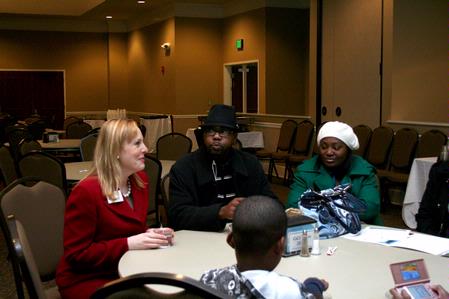 Kimberly Thornbury, vice president for student services and dean of students, talks with a prospective student and her family during a preview day.