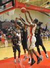 The Bulldogs battle Bethel University for the ball. The Bulldogs won the game by one shot, 77-75.  - Photo by Morris Abernathy