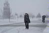 Students and faculty make their way across campus during a heavy snowfall. - Photo by Morris Abernathy