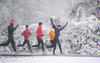 The cross country team doesn't let anything stop them from running, even snow! - Photo by Morris Abernathy