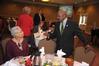 Harrell Carter greets guests of the Black History Month Program where Renita J. Weems, author and vice president of academic affairs at American Baptist College, was the guest speaker.  - Photo by Morris Abernathy