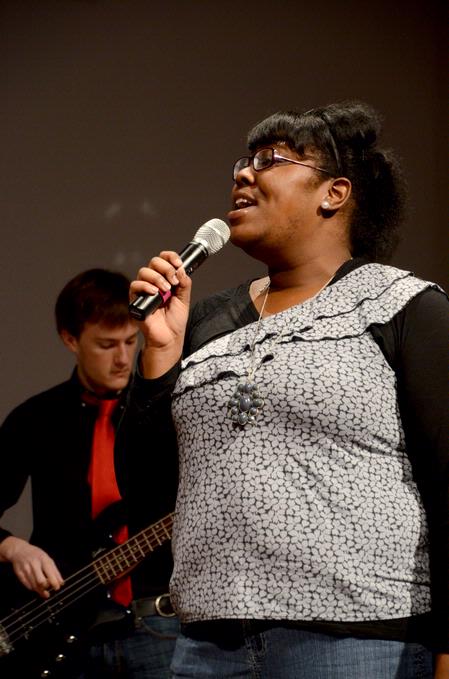 Cheraka McIntosh, sophomore nursing major, sings at the beginning of chapel.