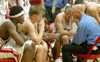 Ralph Turner, in his 10th season as head coach, talks to the Bulldogs during a timeout. - Photo by Courtney Ross