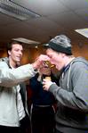 Ashton Walker, sophomore engineering major, holds the nose of Jonathan Anderson, junior art major, as he eats baby food for a challenge during Residence Life's the Amazing Race. - Photo by Deanna Santangelo