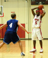 Freshman guard, Marcus Cooper (5) is in no rush to pass or shoot during the 110-71 win over Williams Baptist. - Photo by Courtney Ross
