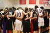 The Lady Bulldogs and opponents Bethel University join together in prayer after their game, which The Lady Bulldogs won 81-62. - Photo by Ebbie Davis