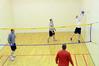 Students play intramural wall ball in the racquetball courts. - Photo by Beth Spain