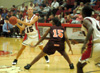 Laura Davison (15) looks to pass to the cutting Latorya Fuller (4) in a 91-64 win over Claflin. - Photo by Courtney Ross