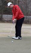 Micah Gentle practices putting at the Jackson National Golf Course. - Photo by Beth Spain
