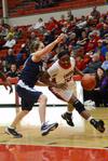 Lady bulldog Lavanda Ross pushes past her Lyon College opponent as she goes for a lay-up. The Lady Bulldogs won the game 65-44. - Photo by Beth Spain