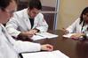 Pharmacy students go over their patient notes during class.  - Photo by Kristi McMurry