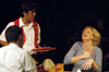 Lucas Villalpondo as Hector Hazada serves Stephen Kennedy and Emily Brown as Harvey and Sandy Gold in <i>You Have To Serve Somebody</i>. - Photo by Jim Veneman