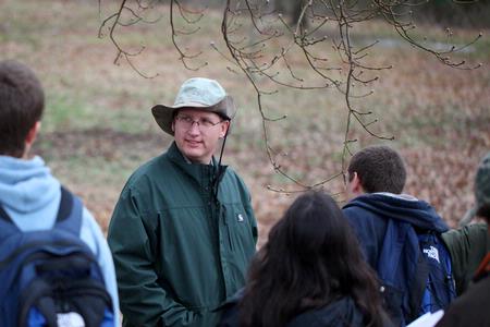 Andy Madison, associate professor of biology, takes a tour around the West TN Research & Education Center with students to observe various trees and their characteristics. 
