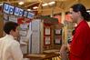 Fonsie Guilaran, associate professor of physics, talks with one of the exhibitors at the West Tennessee Science Fair, which Union University hosted. - Photo by Victoria Stargel