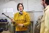 Haelim Allen, assistant professor of art, explains to her sculpture students how to operate the cutting torch during class.  - Photo by Kristi McMurry