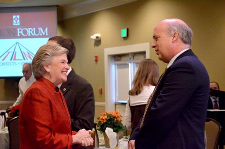 Lanese Dockery, first lady of the university, greets speaker Scott Rasmussen, founder and president of Rasmussen Reports, during Union Forum in the Carl Grant Event Center.