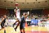 Lavanda Ross shoots high above a block attempt by her Avila University opponent during the first game of the NAIA National Championship.  - Photo by Abigail Harris