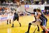 Kayla Hudson looks to pass the ball to Zeinab Chan under the basket during the first game of the NAIA National Championship. - Photo by Abigail Harris