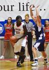 Zeinab Chan looks for an opening to shoot in the semifinals game of the NAIA National Championship. - Photo by Beth Spain