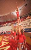 The cheerleaders warm up before the semifinals game of the NAIA National Championship. - Photo by Morris Abernathy