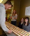 Physics students pass out cupcakes laden with the digits of pi in honor of Pi Day and Einstein's Birthday, March 14. - Photo by Victoria Stargel