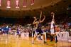 Kayla Bryant looks around for a teammate to pass to during the second round game of the 2011 NAIA Division I Women's Basketball National Championship. - Photo by Ebbie Davis
