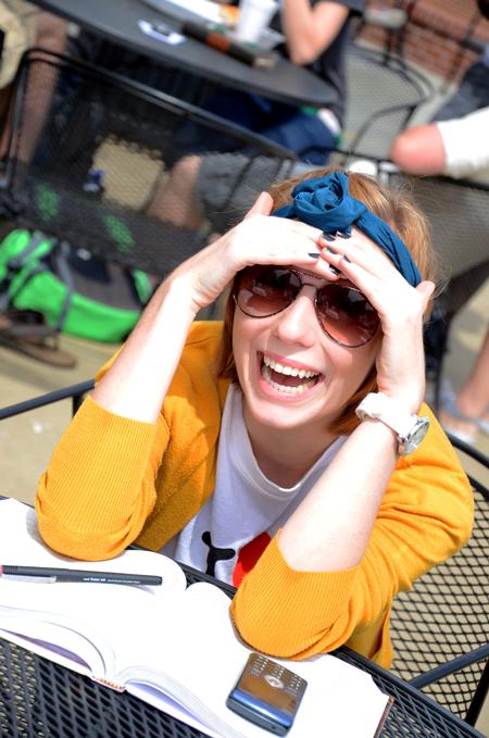 Margaret Brinson, senior journalism major, laughs with friends while studying outside of Barefoots Joe on one of the first warm days of the semester.  