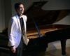 Sam Ritter, junior music major, takes a bow after his junior piano recital. - Photo by Abigail Harris