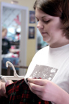 Sophomore Jennifer Hanes volunteers her time during Day of Remembrance. - Photo by Lindsay Stavish