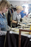 Union staff members Robin Navel and Elsie Cressman work at RIFA sorting clothing on the Day of Remembrance. - Photo by Lindsay Stavish