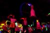 The independent group "There and Back Again" performs a <em>Back to the Future</em> skit with glow sticks at the 14th annual Variety Show.  - Photo by Ebbie Davis