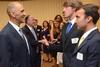 Tony Dungy, the first African American coach to lead an NFL team to Super Bowl victory, greets Jacob Long, sophomore athletic training major, during the Roy L. White Golf and Gala.  - Photo by Beth Spain